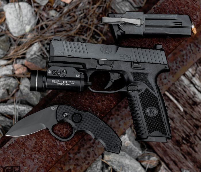 A solid carry combo with the FNH FN-509 with a Colonel Blades folding knife and spare mag equipped with a NeoMag.